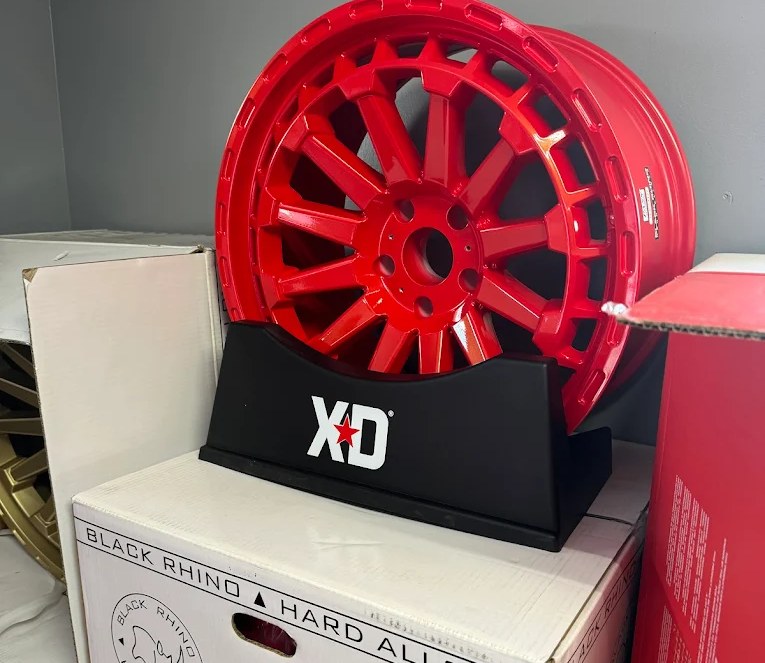 Red Black Rhino alloy wheel on XD display stand